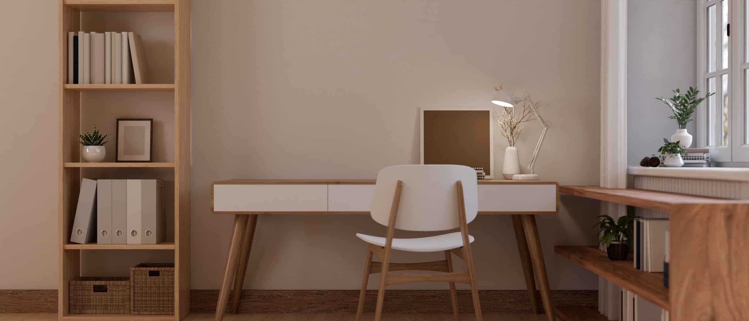 A bright study room with a desk and chairs